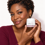 Black woman in her early forties holding Firm YOU firming cream